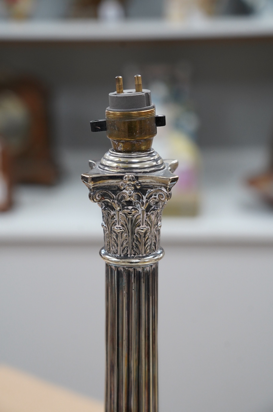 A silver plated Corinthian column table lamp, 42cm. Condition - worn, not tested as working